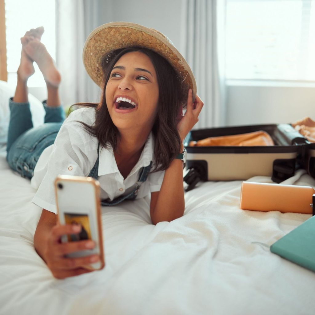 An Airbnb property manager analyzing data on a computer, showing dynamic pricing and guest inquiries.