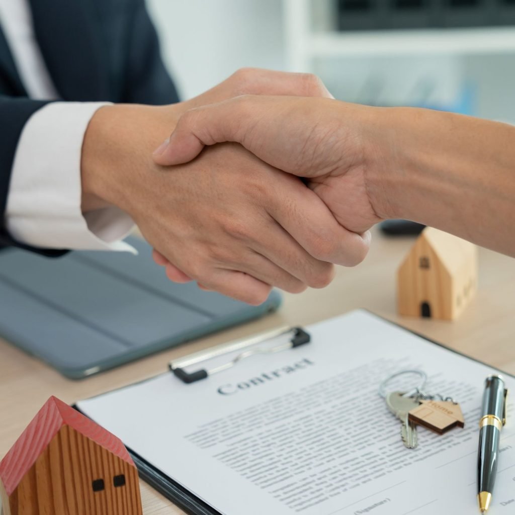 Handshake symbolizing a business deal for property management in Florida.