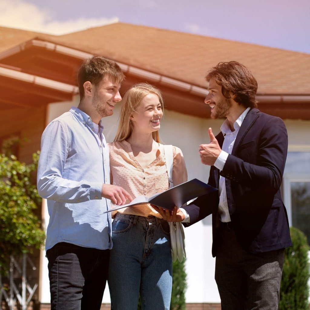 Property manager showing a house to two tenants as part of the Section 8 housing program in Georgia.