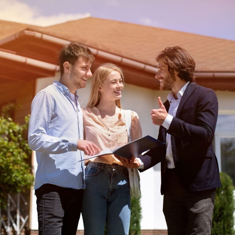 Property manager showing a house to two tenants as part of the Section 8 housing program in Georgia.